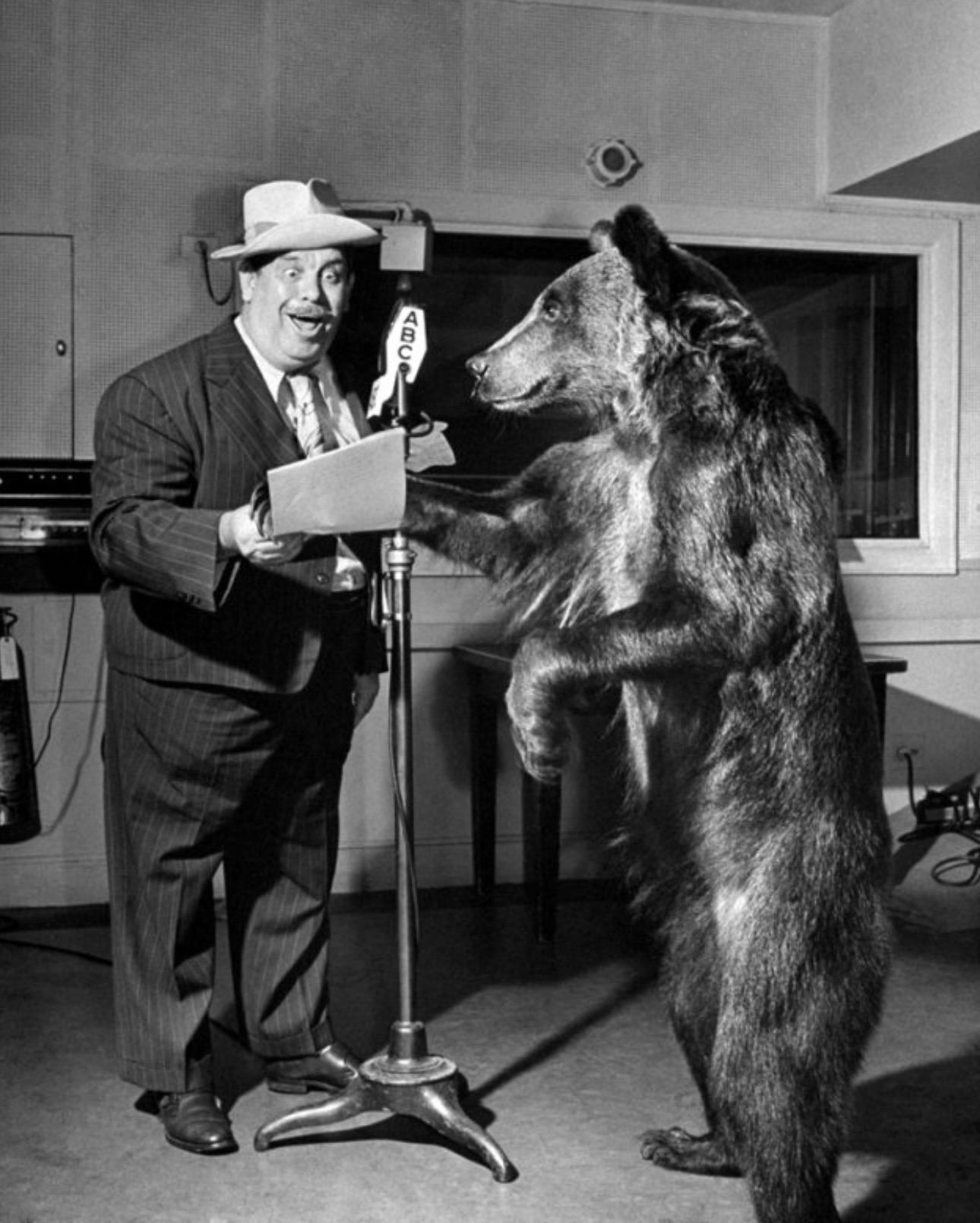 Rosie the bear rehearses with comedian Lew Leh, 1945